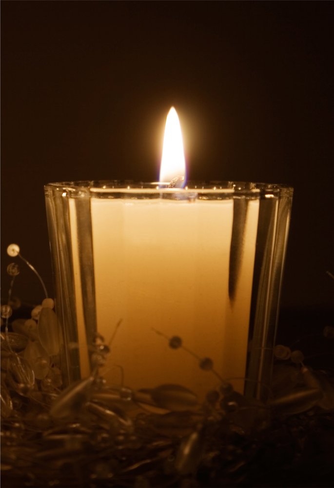 bride lighting remembrance candle